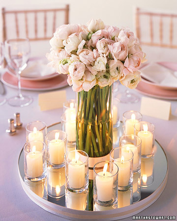 A simple and elegant table centerpiece featuring clear glass votives that 